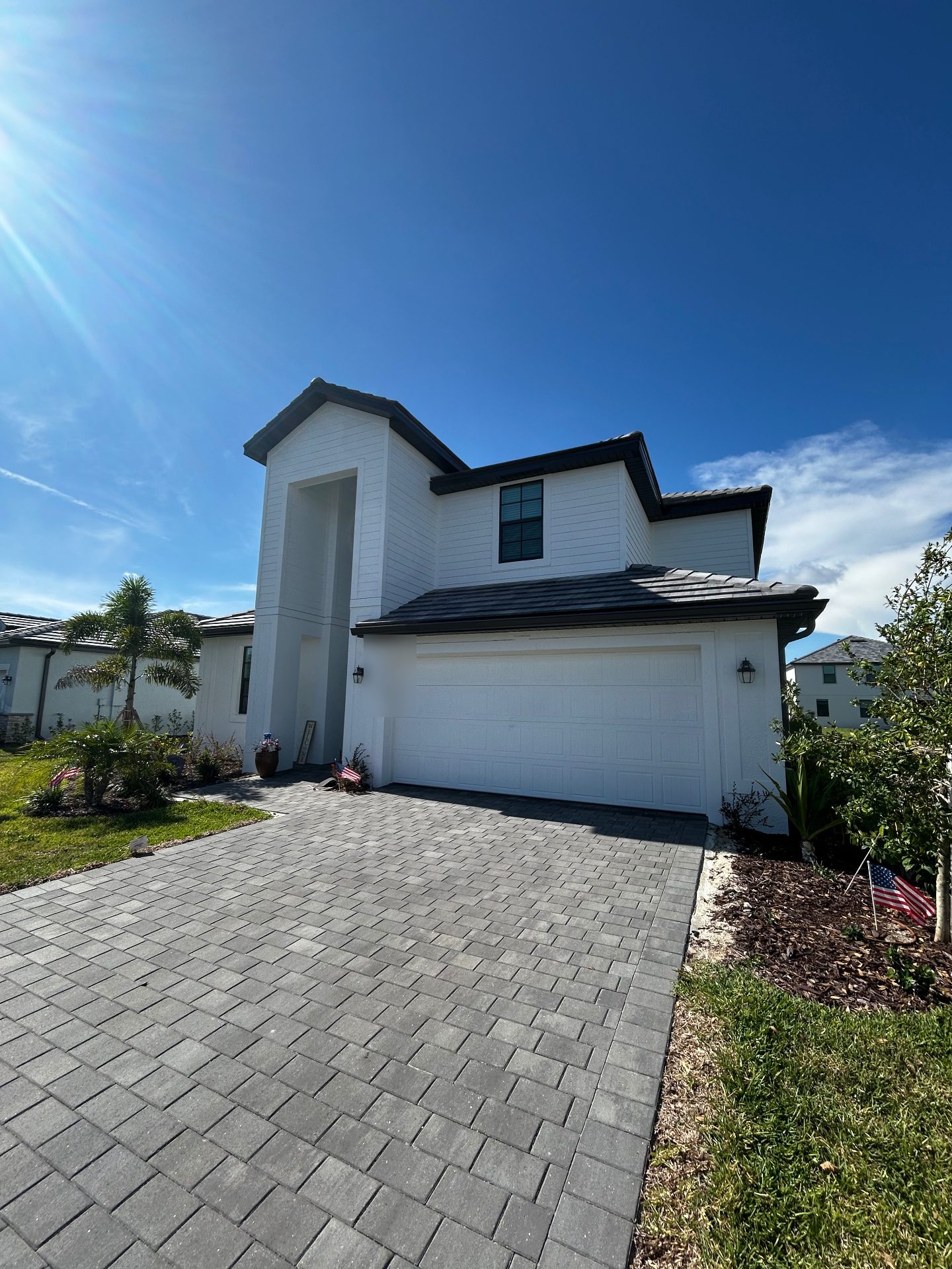 Beautiful Florida home with pristine landscaping and driveway